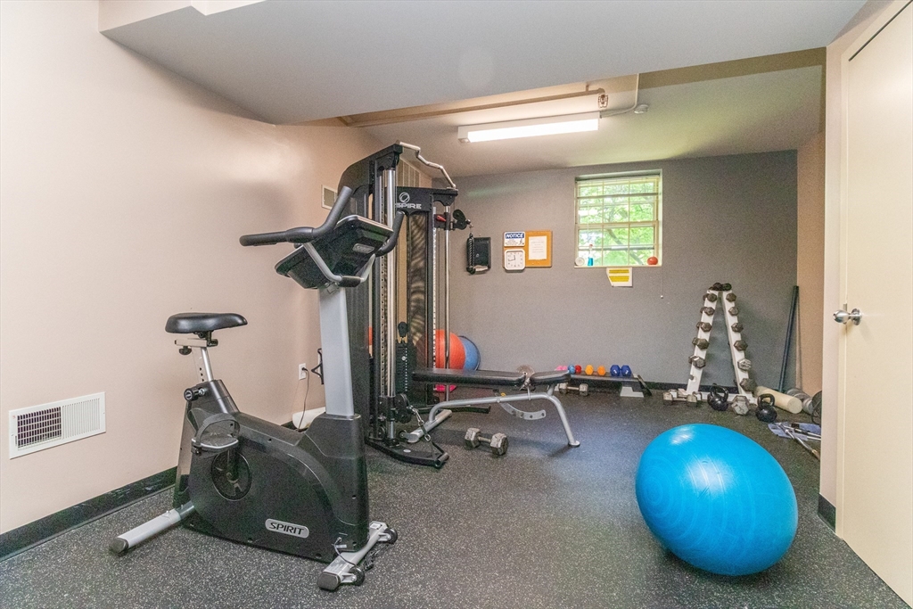 60e Glen Road, Unit 306 Brookline, MA 02445 - Photo 25 of 27 a room with gym equipment
