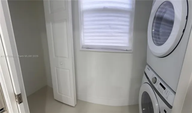a close view of a utility room with washer and dryer