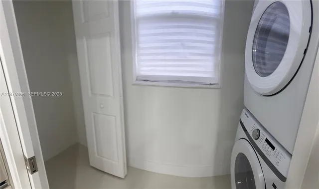 a close view of a utility room with washer and dryer