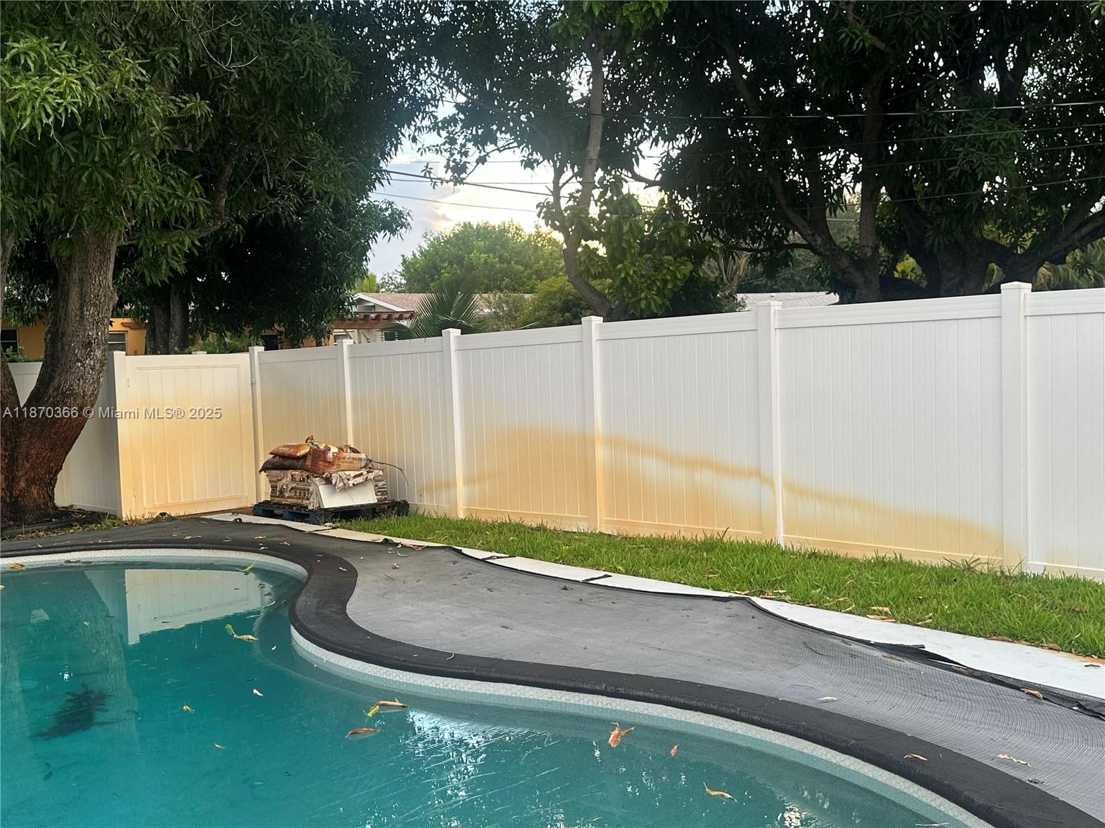 526 South Rainbow Drive Hollywood, FL 33021 - Photo 17 of 20 a backyard of a house with table and chairs