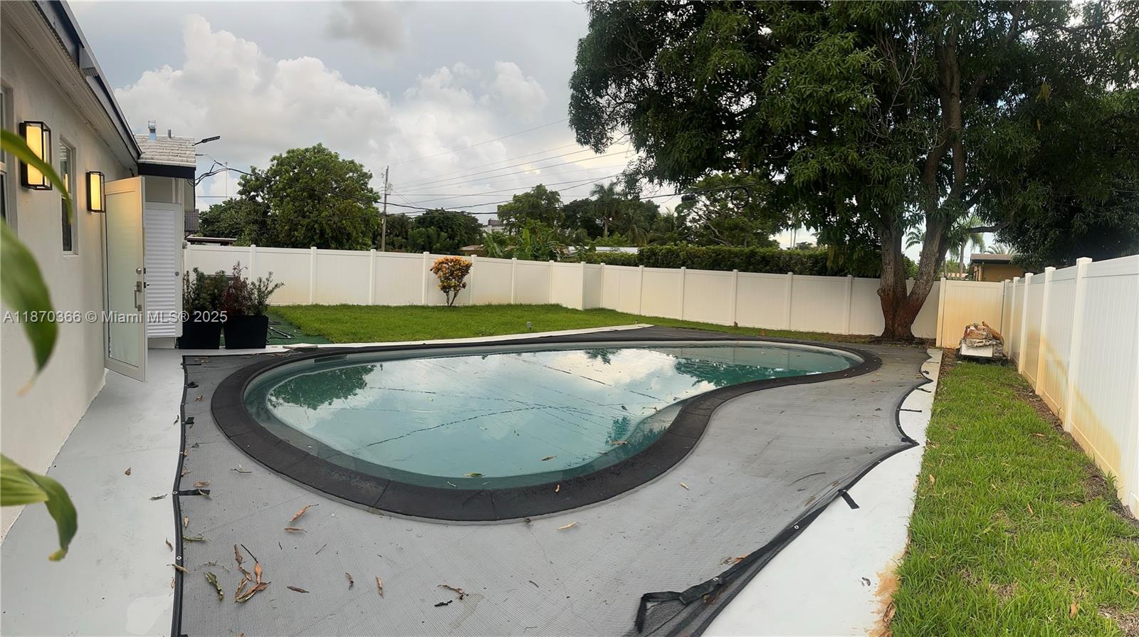 526 South Rainbow Drive Hollywood, FL 33021 - Photo 19 of 20 a view of a swimming pool with a yard
