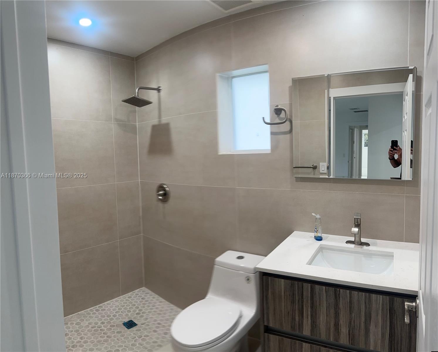 526 South Rainbow Drive Hollywood, FL 33021 - Photo 7 of 20 a bathroom with a sink toilet a mirror and shower
