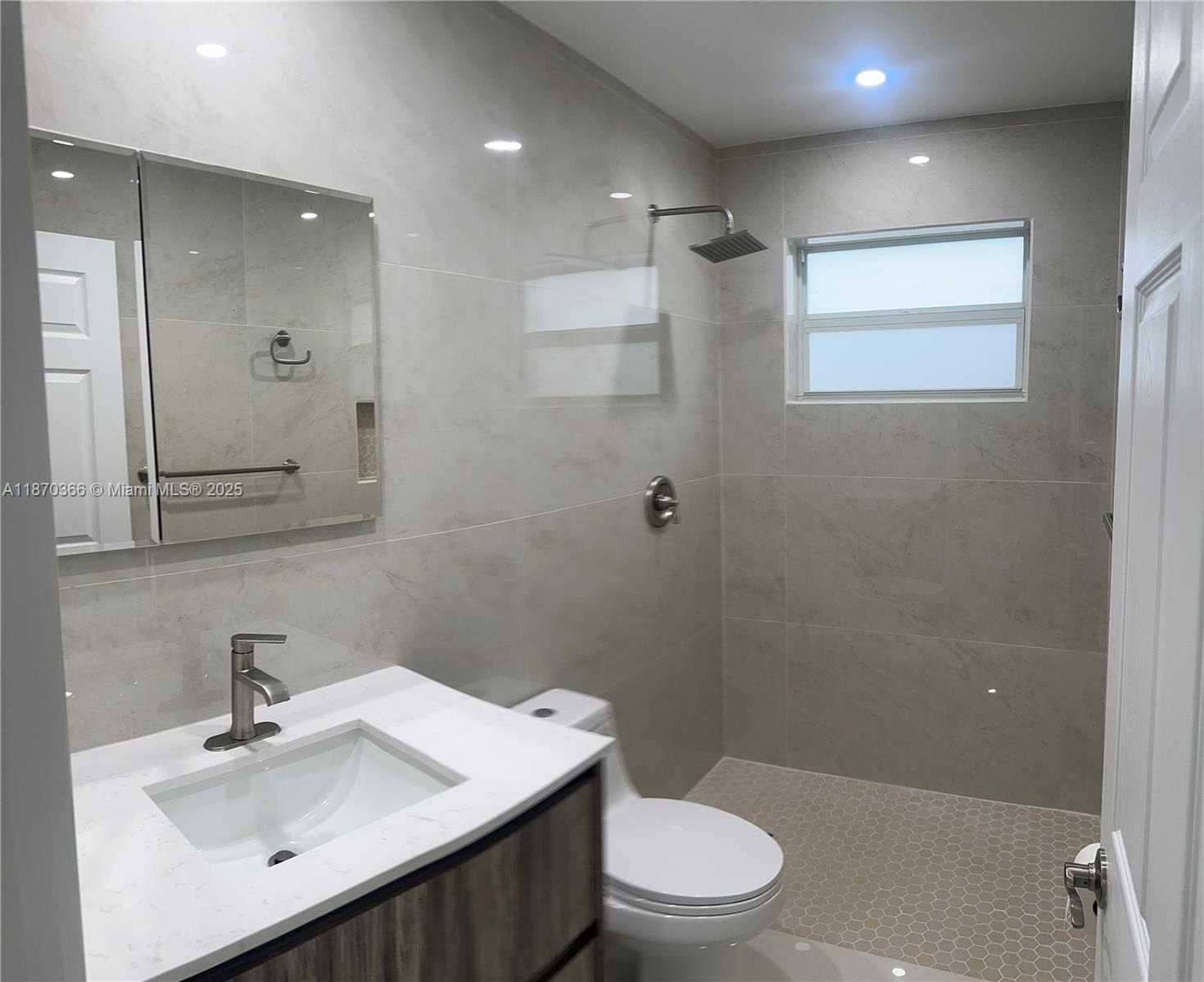 526 South Rainbow Drive Hollywood, FL 33021 - Photo 8 of 20 a bathroom with a sink toilet and shower