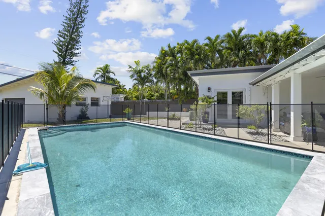a view of a backyard with a patio