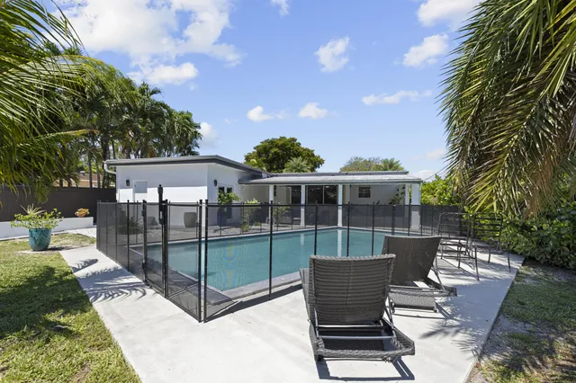 a bedroom with a large bed and a large window