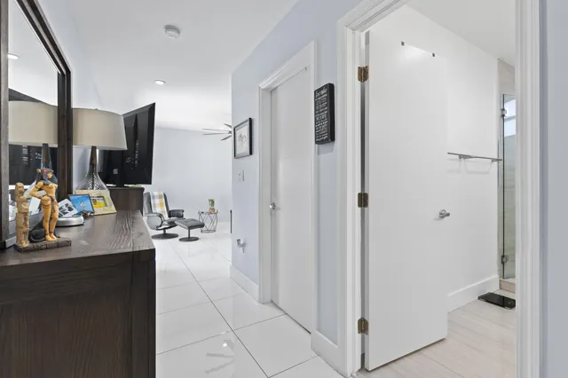 a bedroom with a bed and a desk