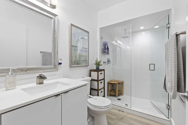 a bedroom with furniture and large window