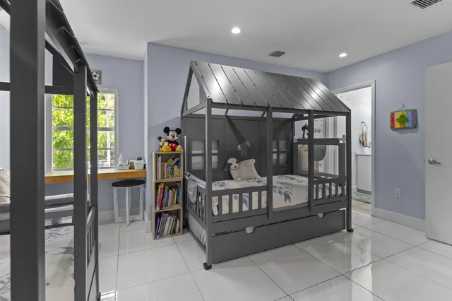 a living room with furniture and next to a window