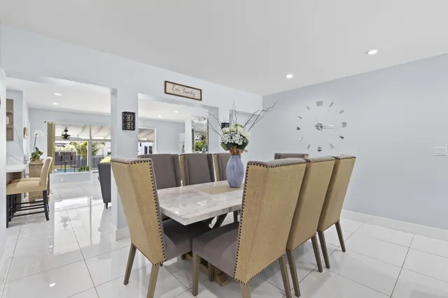 a dining room with furniture and wooden floor