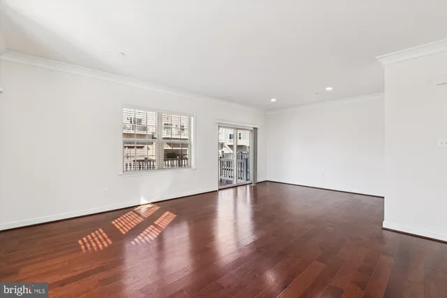 a view of an entryway with wooden floor and stairs
