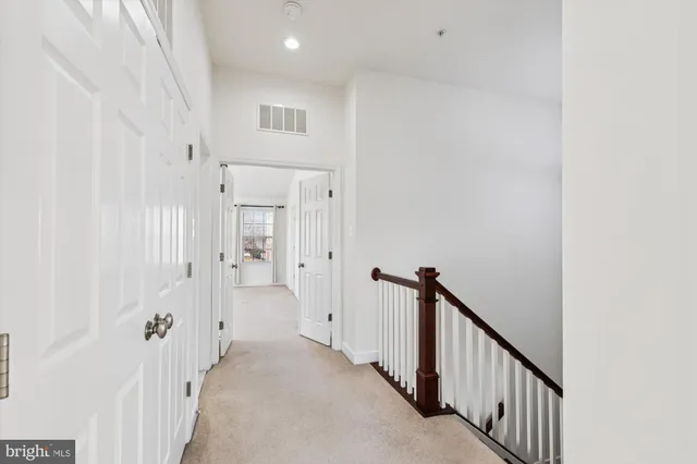 a bathroom with a sink and mirror with toilet