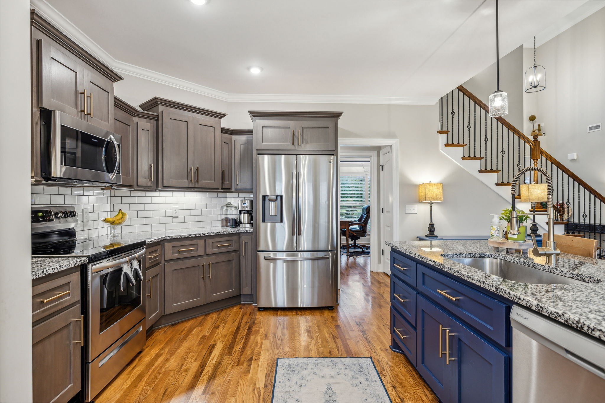 718 Walnut Grove Road Christiana, TN 37037 - Photo 16 of 49 a kitchen with granite countertop a refrigerator a stove top oven a sink and dishwasher