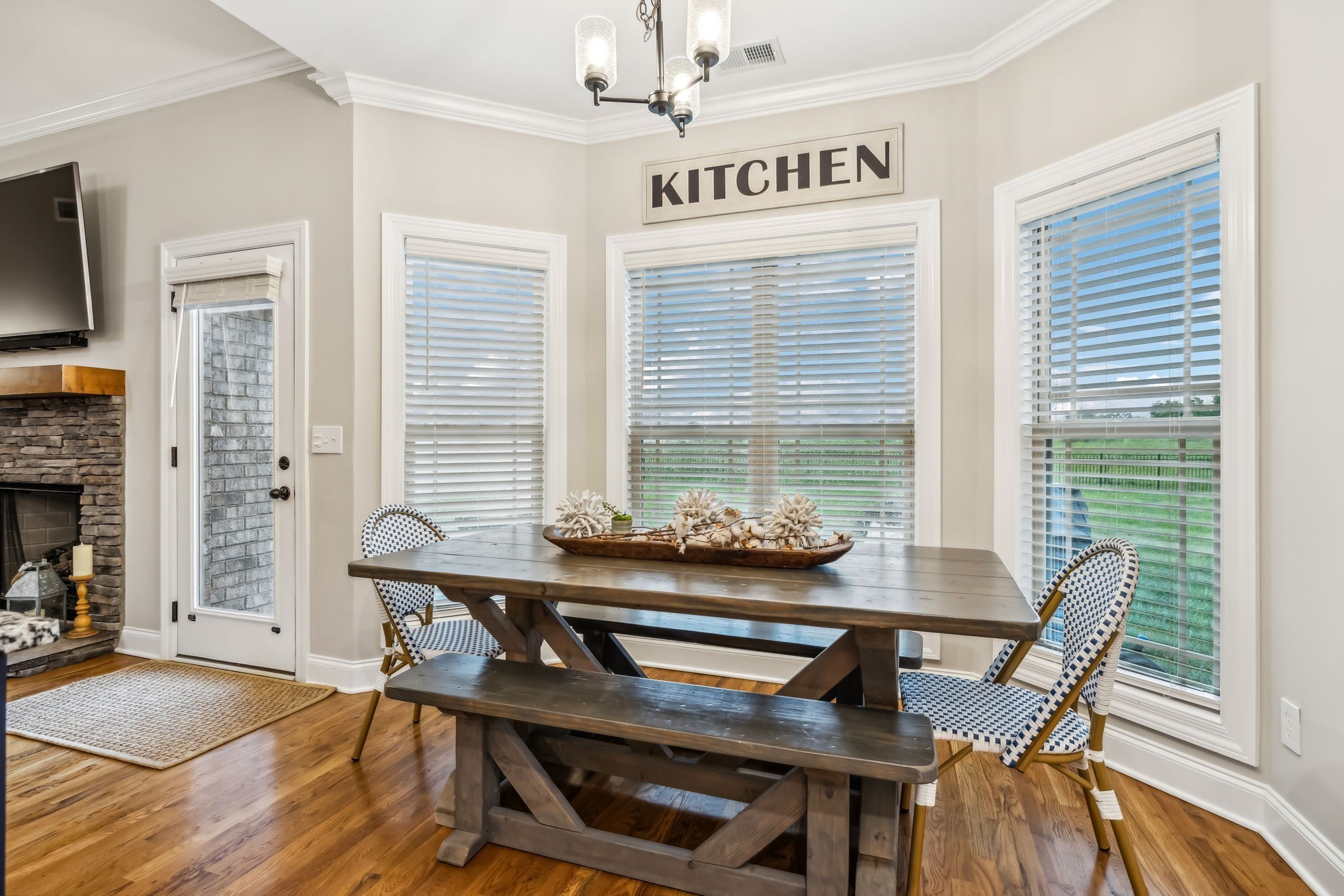 718 Walnut Grove Road Christiana, TN 37037 - Photo 19 of 49 a view of a dining room with furniture window and wooden floor