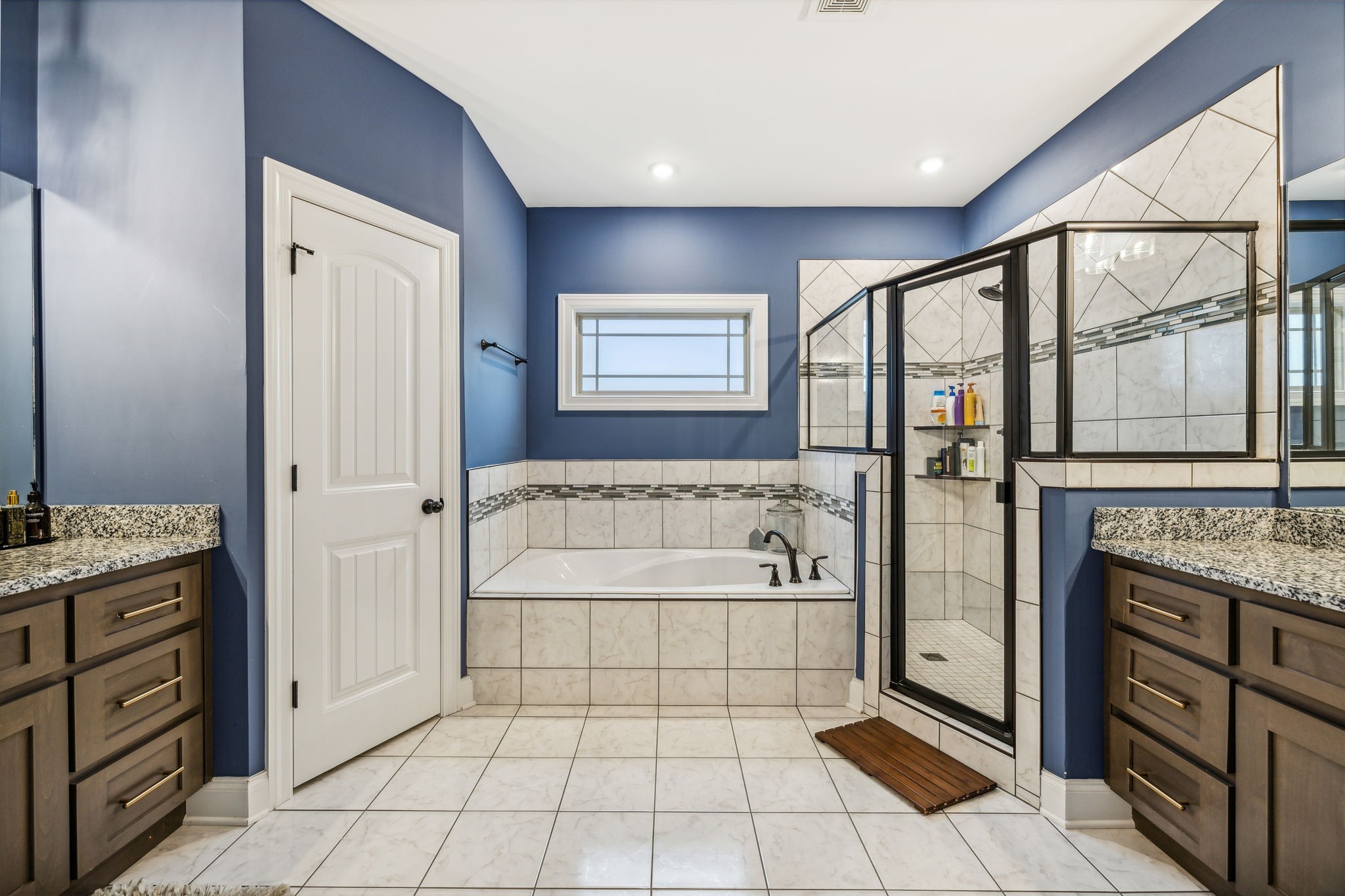 718 Walnut Grove Road Christiana, TN 37037 - Photo 24 of 49 a spacious bathroom with a granite countertop tub sink shower and mirror