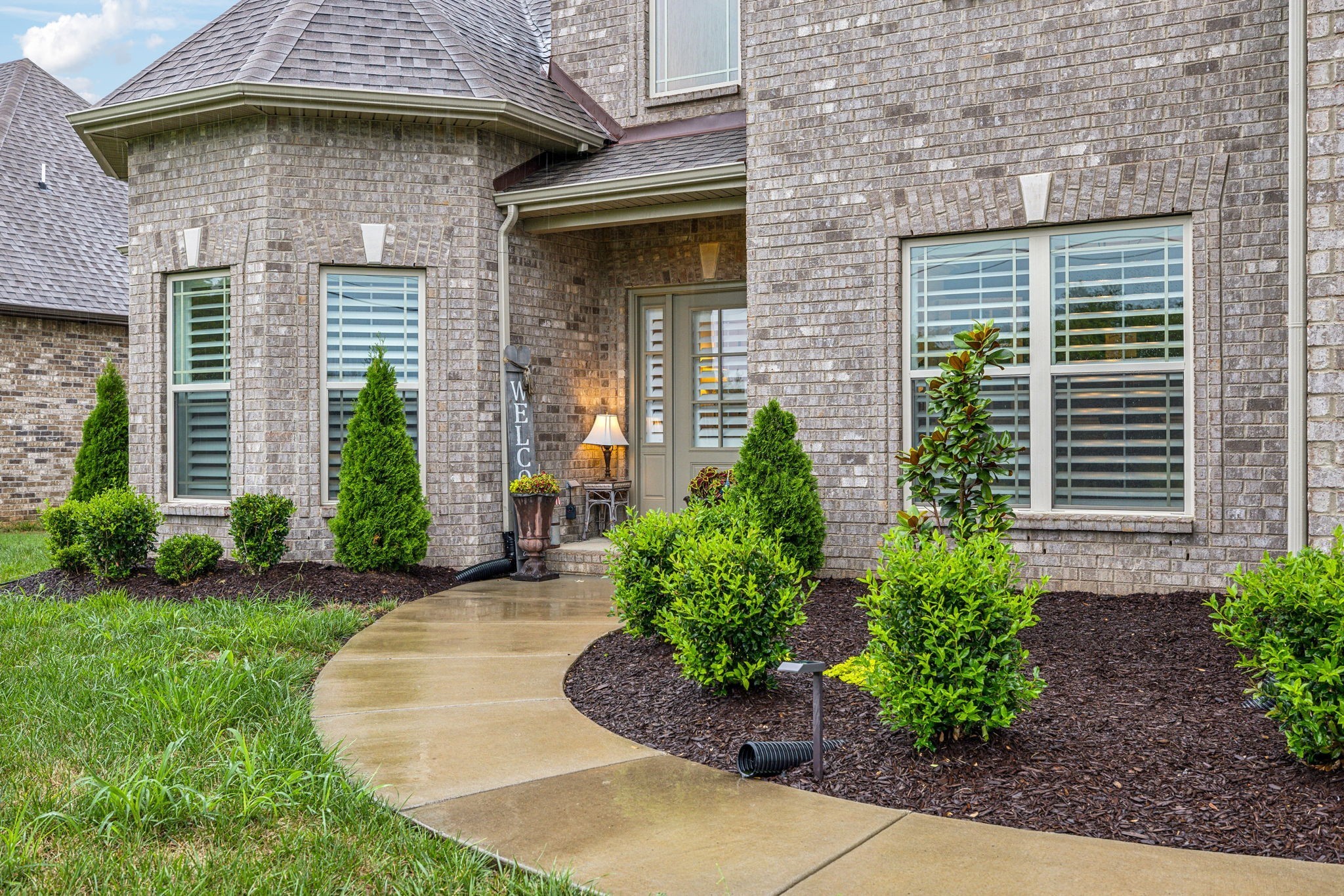 718 Walnut Grove Road Christiana, TN 37037 - Photo 45 of 49 a front view of a house with garden
