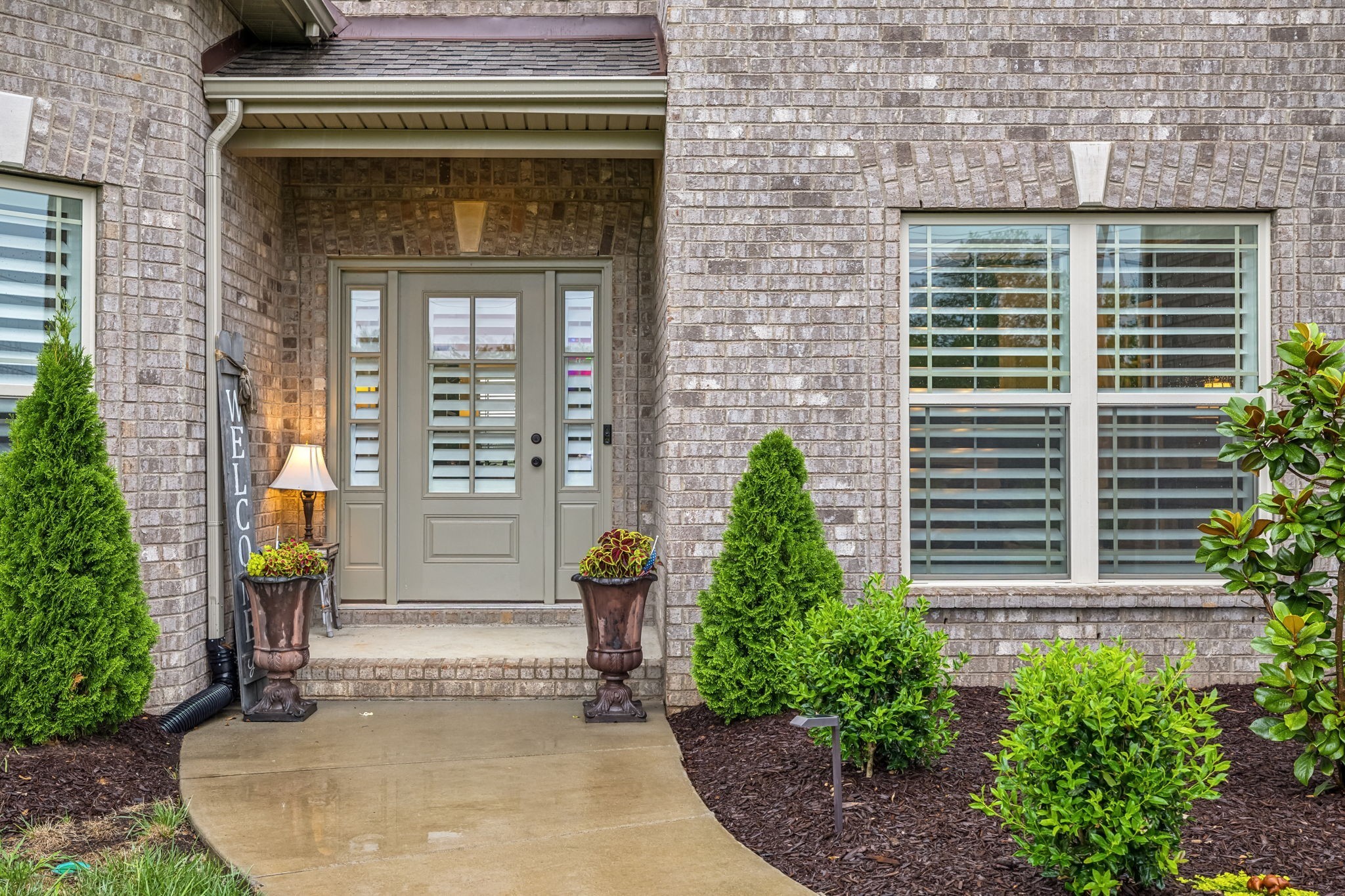 718 Walnut Grove Road Christiana, TN 37037 - Photo 46 of 49 a front view of a house with plants