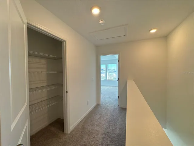 a view of a hallway with closet