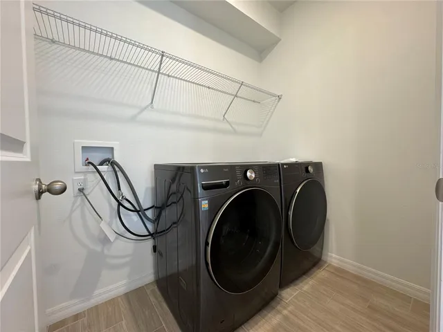 a utility room with dryer and washer