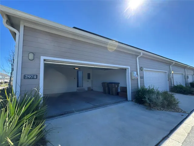 a view of a chairs and table in patio