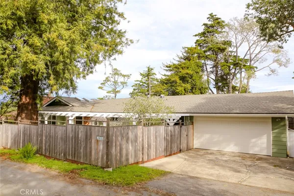 a view of a backyard of the house
