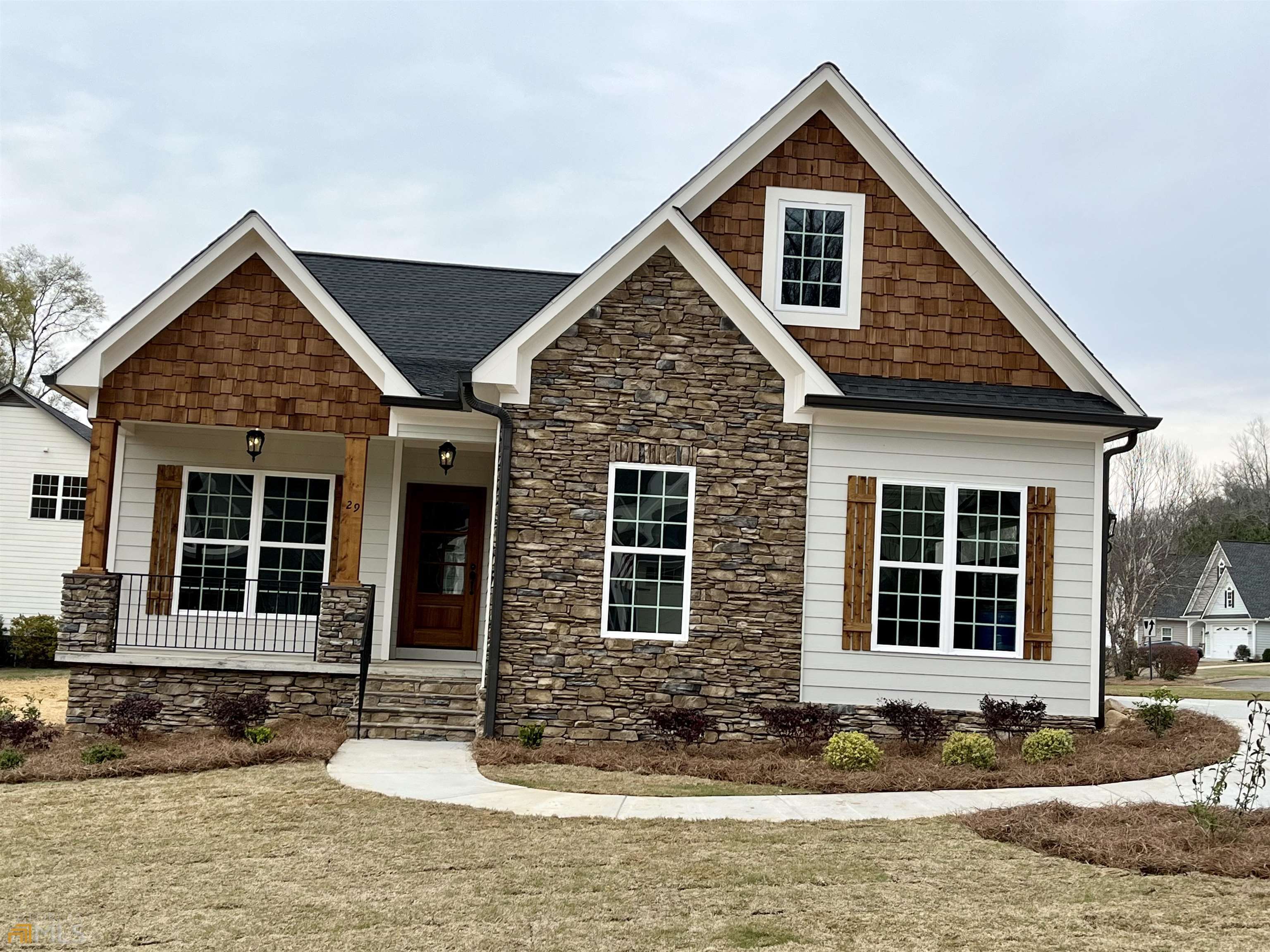 a front view of a house with garden