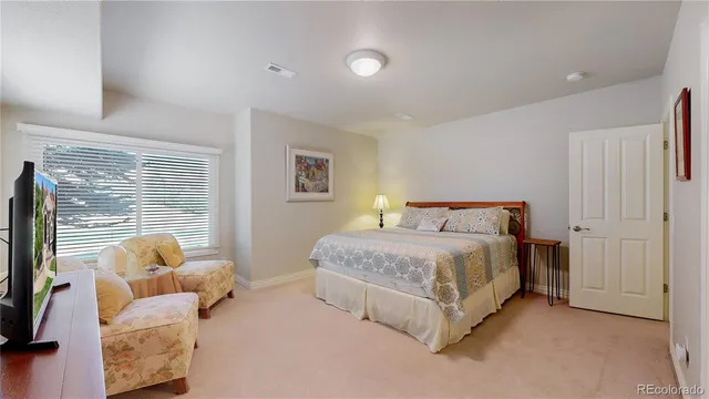 a bed room with a bed and a window