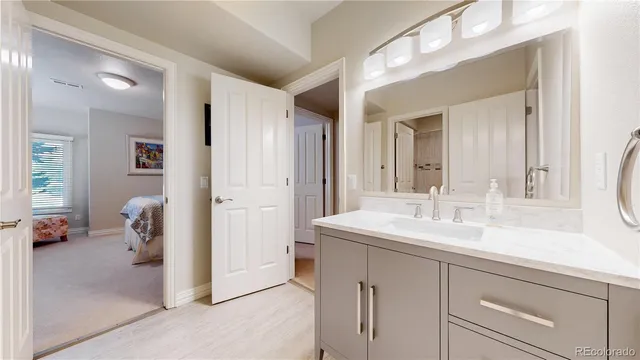 a en suite bathroom with a sink and mirror