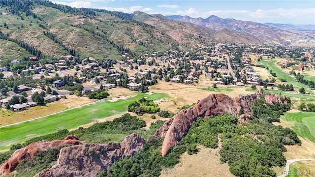 a view of a city with mountains in the background