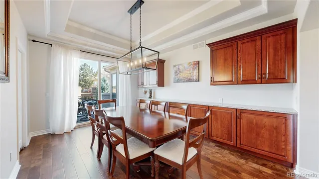 a dining room with furniture window wooden floor