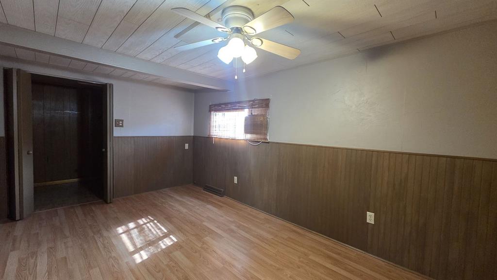 725 Longfellow Street Vandergrift, PA 15690 - Photo 10 of 14 wooden floor in an empty room with a window