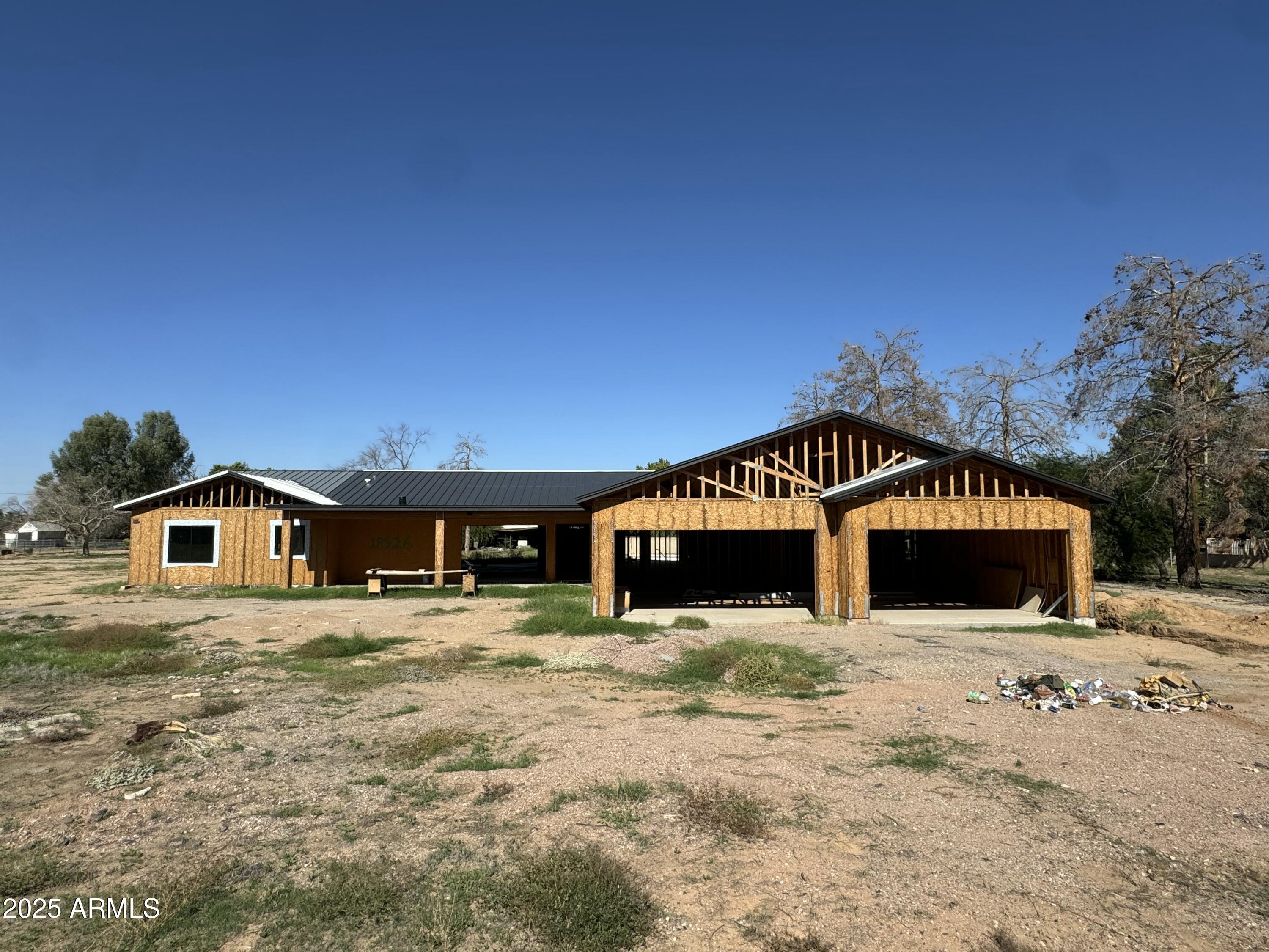 18526 East Cloud Road Queen Creek, AZ 85142 - Photo 1 of 5 a front view of a house with a yard