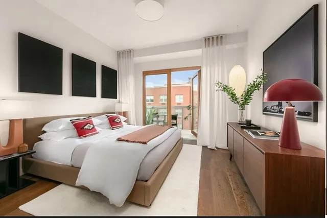 a kitchen with white cabinets and appliances