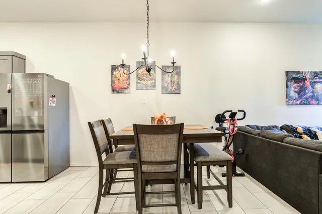 a dining room with furniture and window
