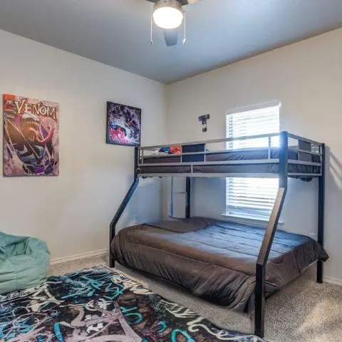 a living room with a couch and a window