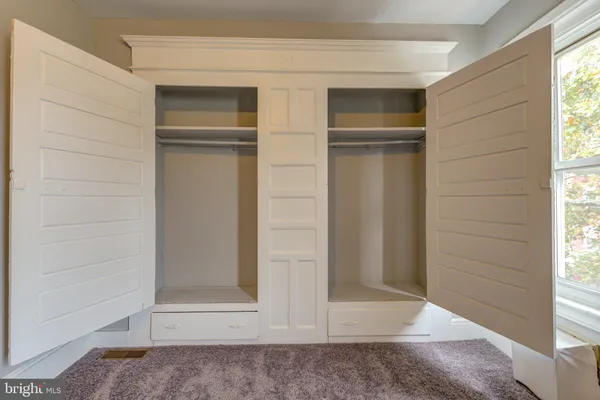 a view of walk in closet with window