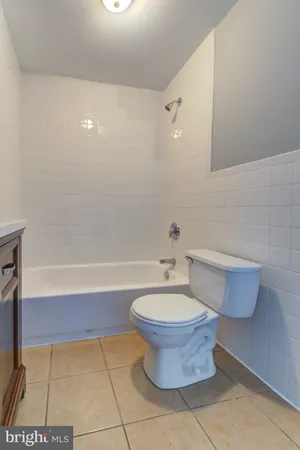 a bathroom with a sink toilet and bathtub
