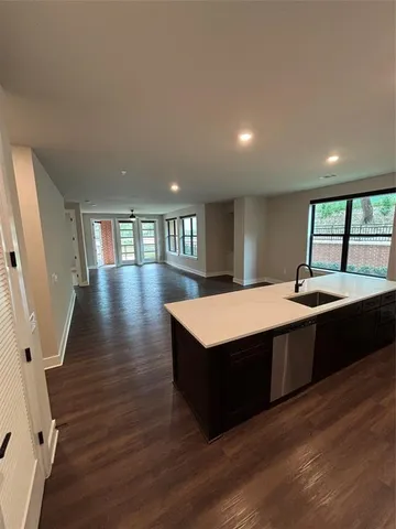 a spacious bathroom with a sink and a large mirror