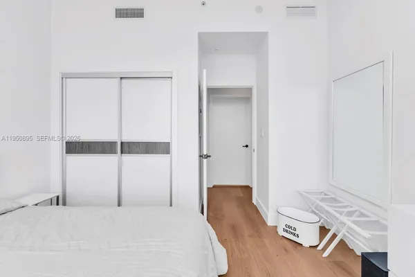 a bedroom with a bed and a table