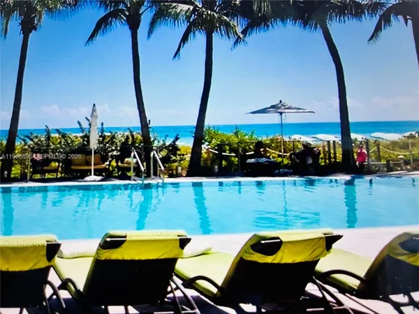 an outdoor sitting area with furniture