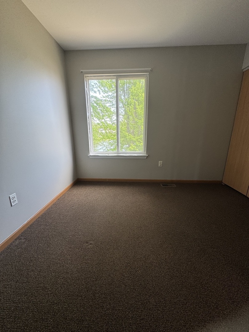 1716 William Drive Romeoville, IL 60446 - Photo 16 of 18 an empty room with a window