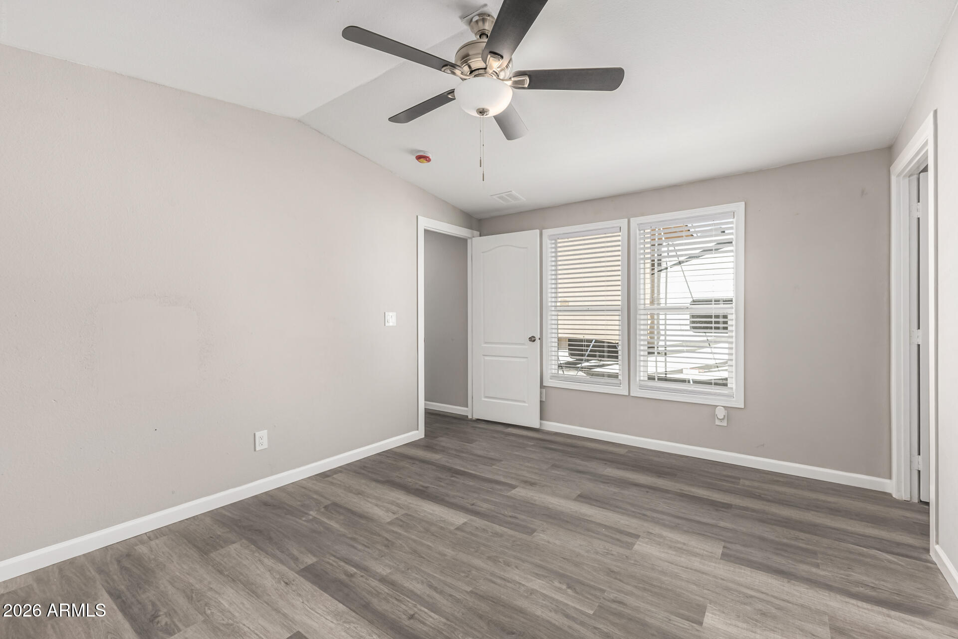625 West McKellips Road, Unit 330 Mesa, AZ 85201 - Photo 14 of 46 wooden floor in an empty room with a window