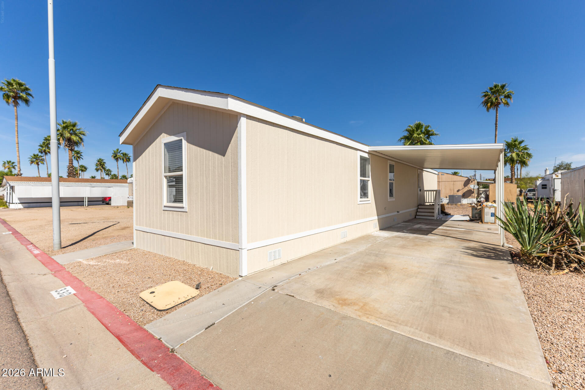 625 West McKellips Road, Unit 330 Mesa, AZ 85201 - Photo 2 of 46 a view of a terrace with chairs