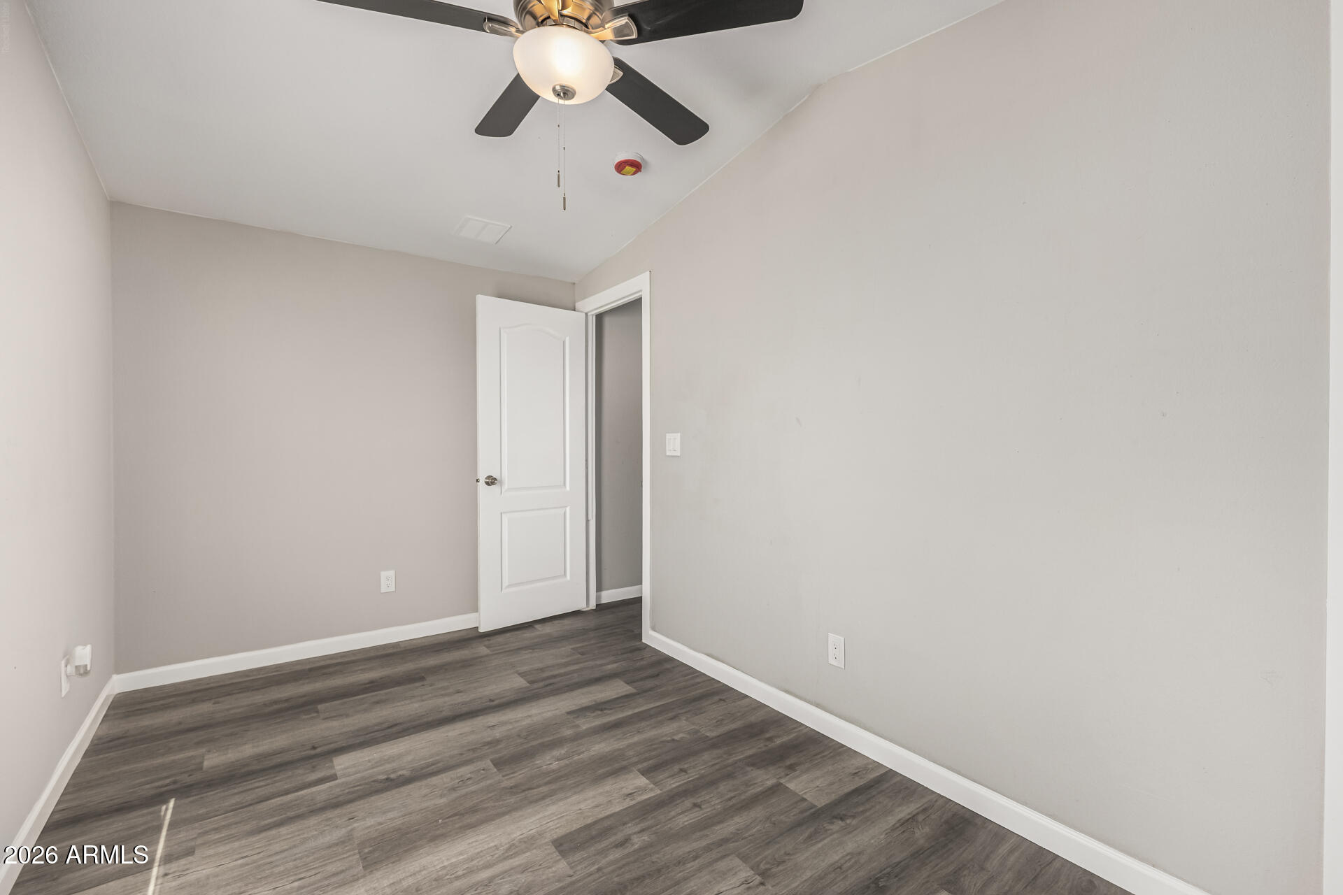 625 West McKellips Road, Unit 330 Mesa, AZ 85201 - Photo 21 of 46 a view of a room with wooden floor and fan