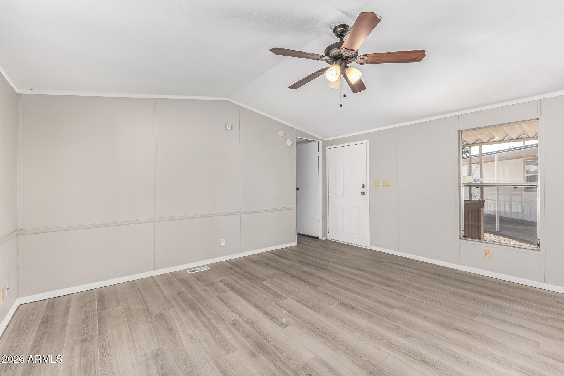 625 West McKellips Road, Unit 330 Mesa, AZ 85201 - Photo 24 of 46 wooden floor in an empty room with a window