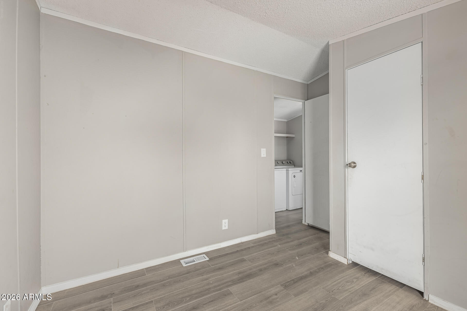 625 West McKellips Road, Unit 330 Mesa, AZ 85201 - Photo 37 of 46 a view of an empty room with wooden floor and a bathroom
