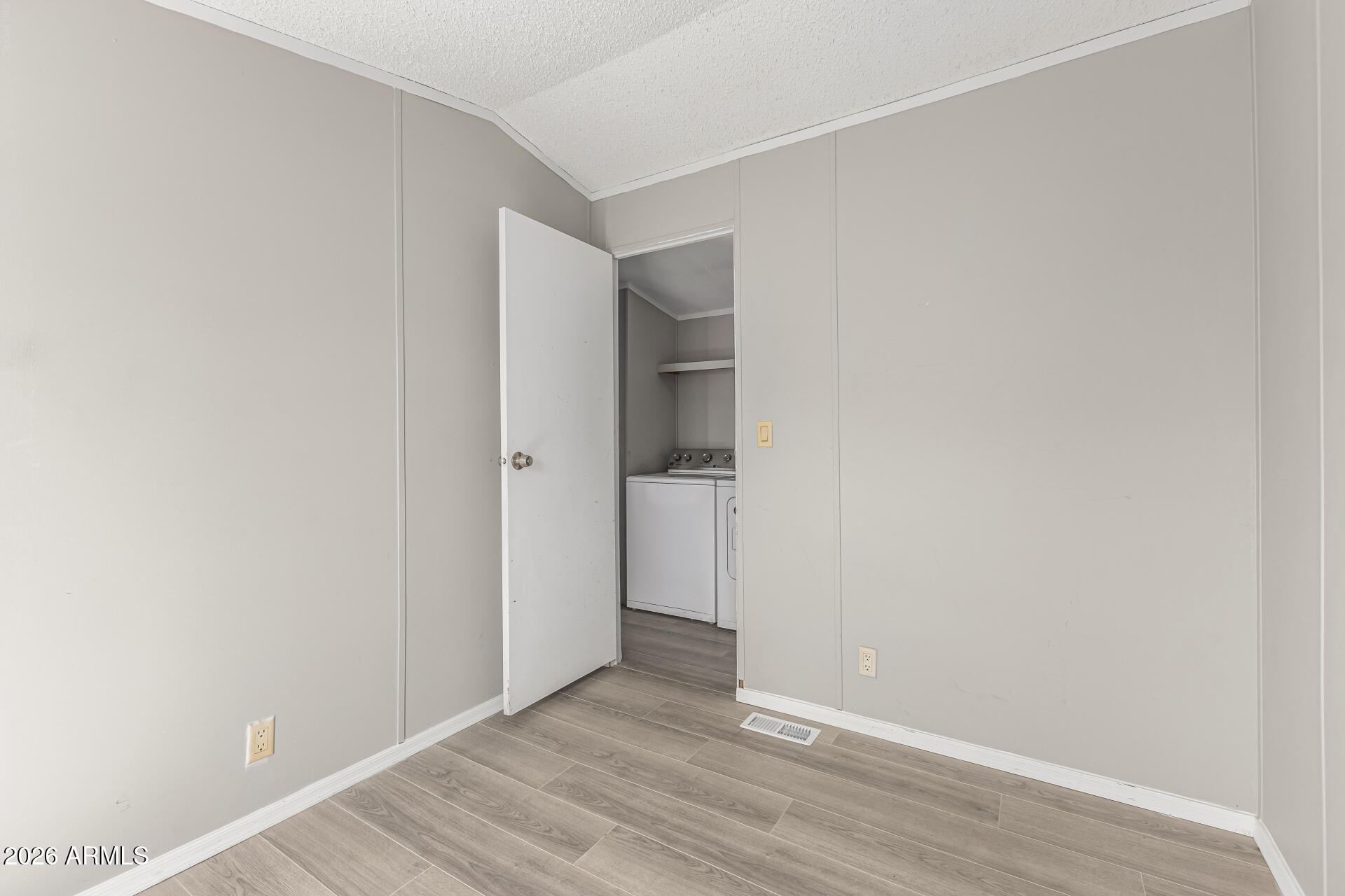 625 West McKellips Road, Unit 330 Mesa, AZ 85201 - Photo 38 of 46 an empty room with wooden floor and closet