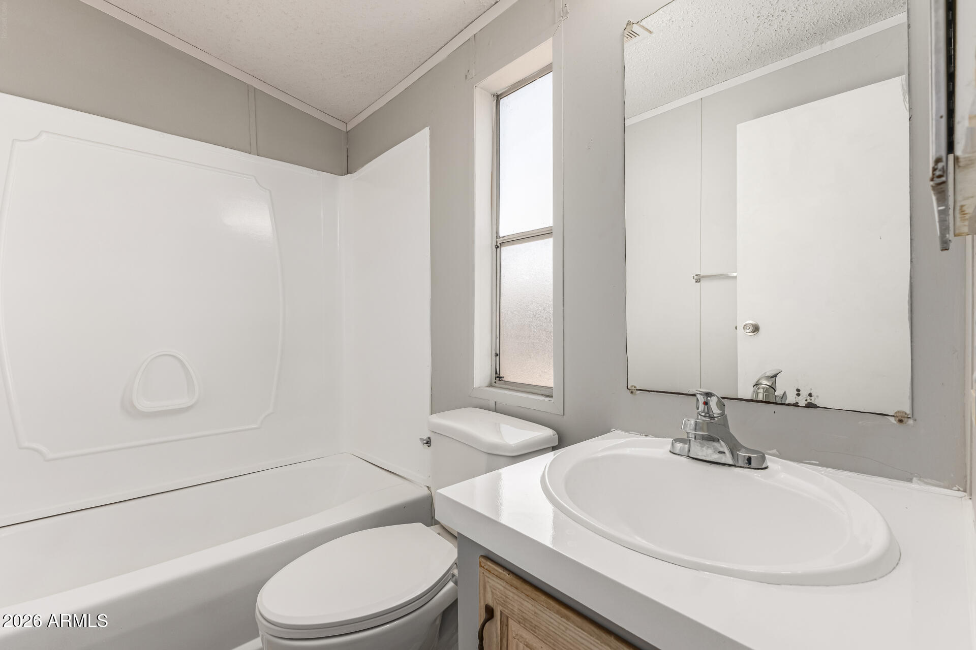 625 West McKellips Road, Unit 330 Mesa, AZ 85201 - Photo 39 of 46 a bathroom with a sink a toilet and tub