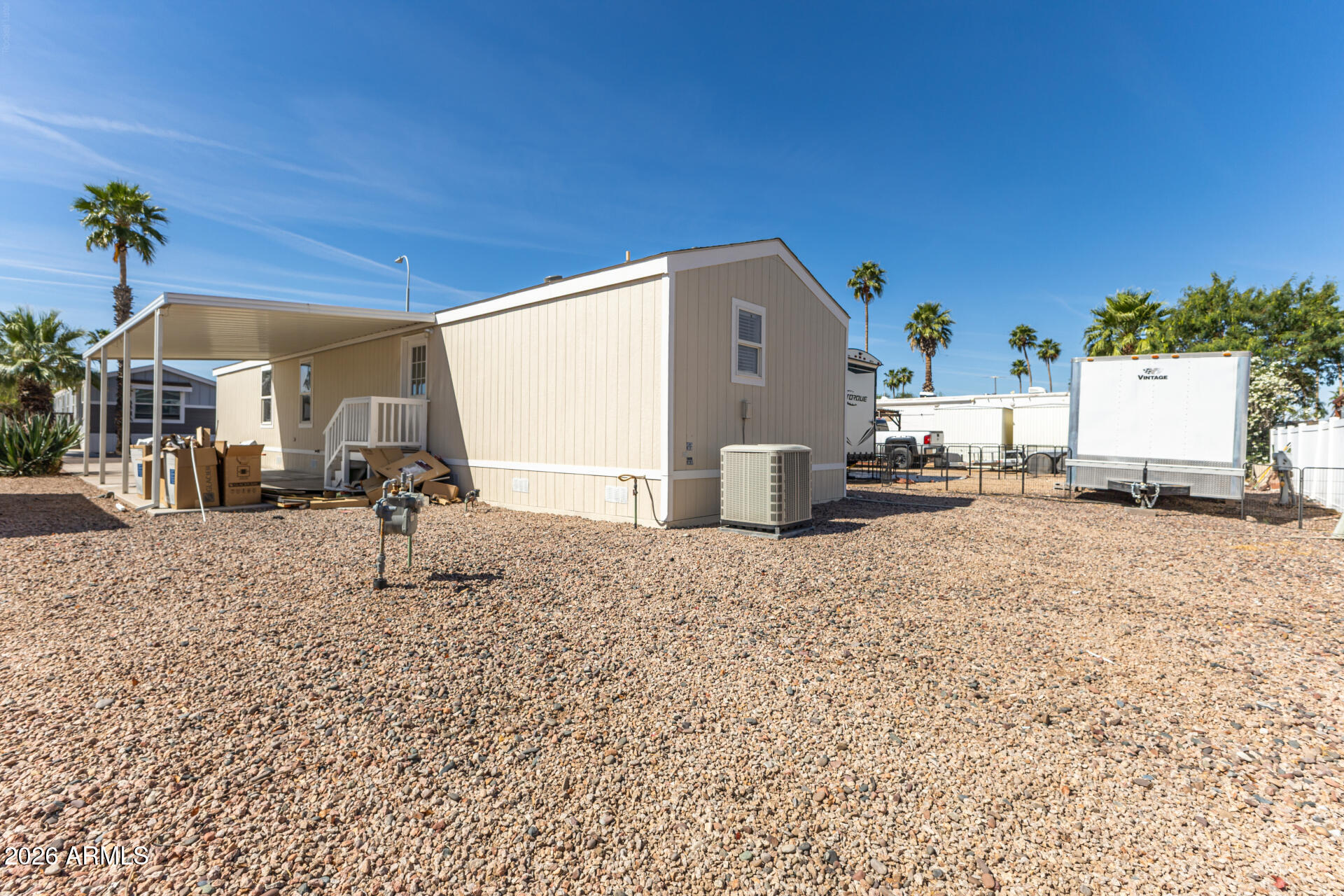 625 West McKellips Road, Unit 330 Mesa, AZ 85201 - Photo 43 of 46 a view of a house with a backyard