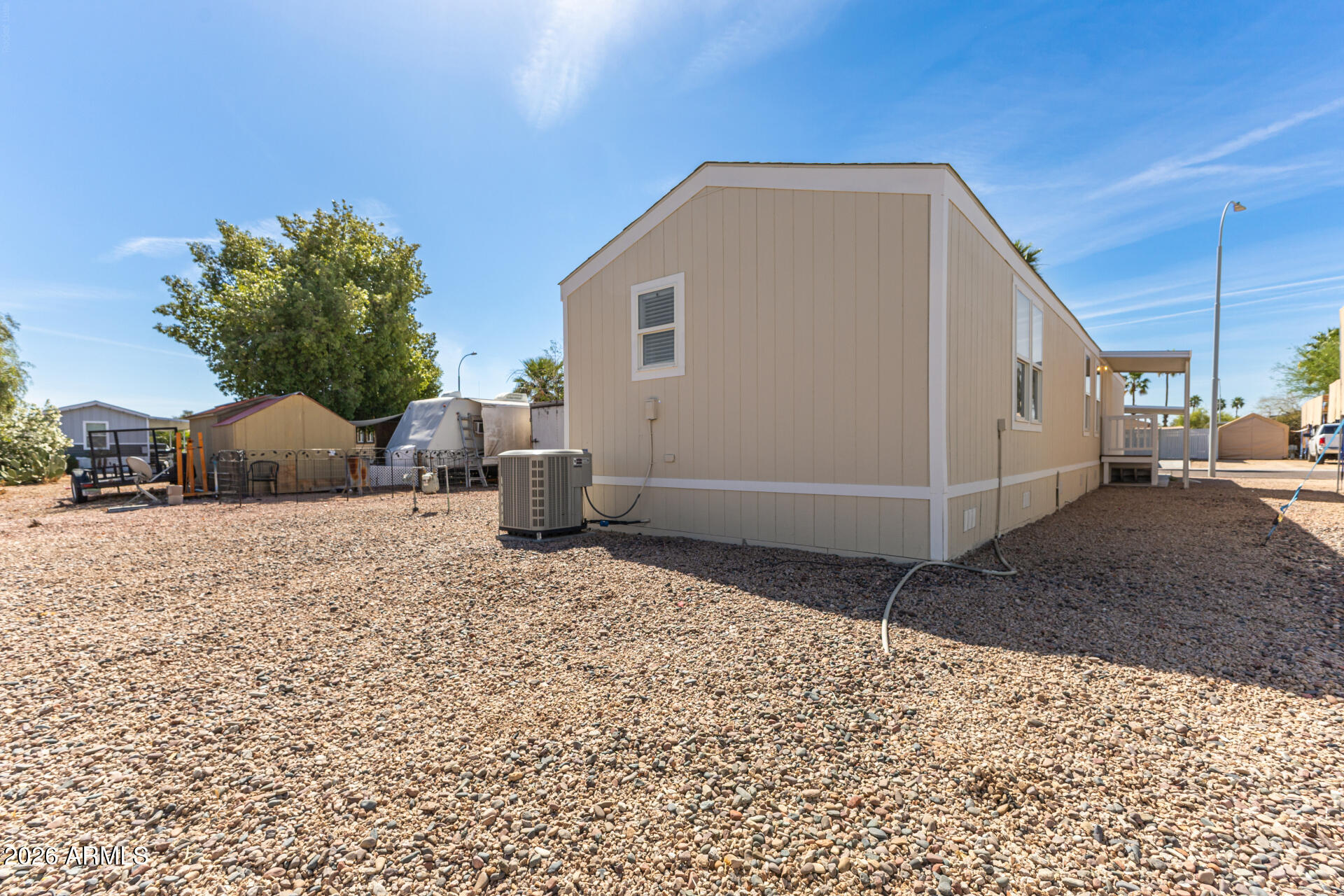 625 West McKellips Road, Unit 330 Mesa, AZ 85201 - Photo 44 of 46 a backyard of a house with lots of green space