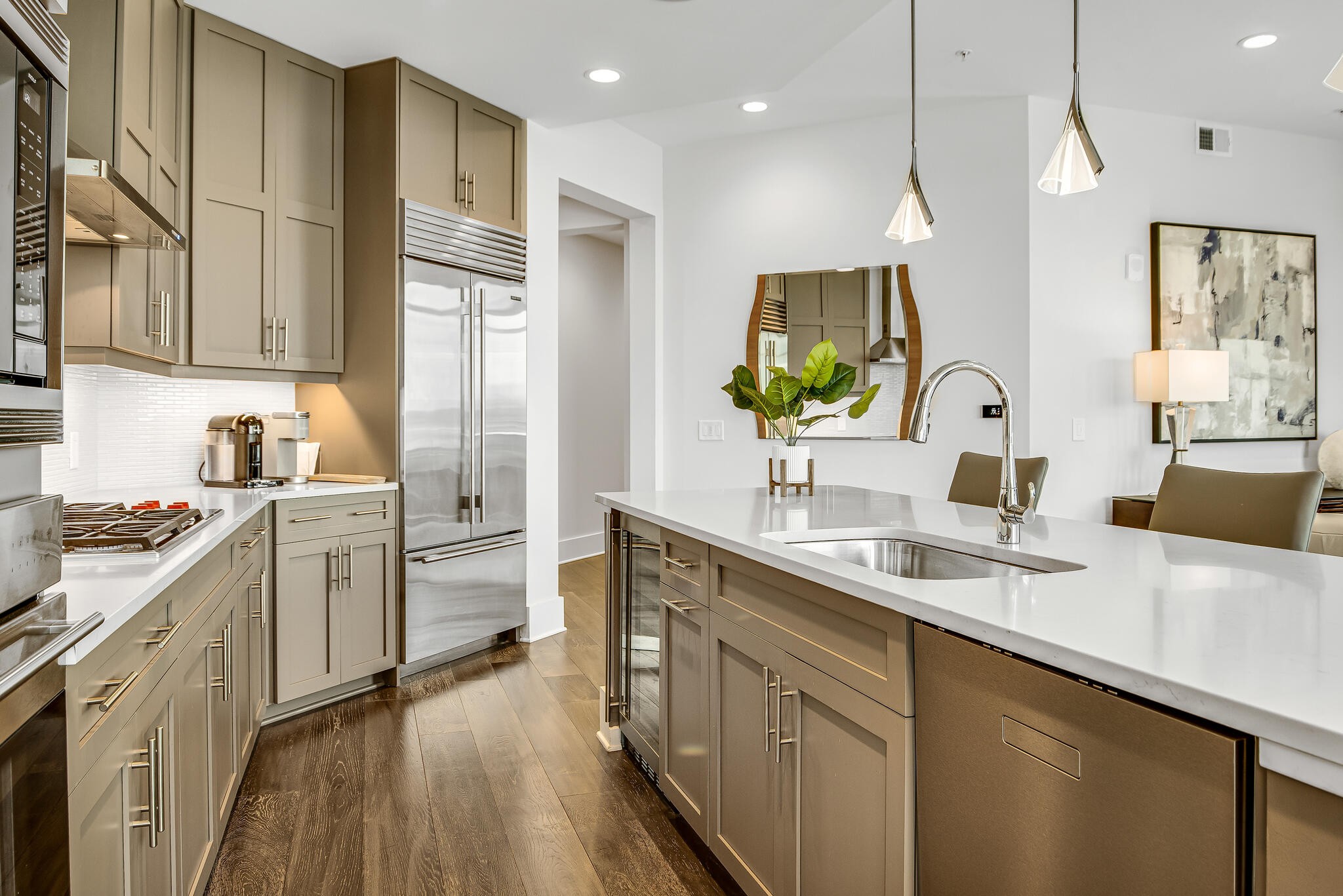 20 Rutledge Street, Unit 407 Nashville, TN 37210 - Photo 11 of 39 a kitchen with white cabinets and appliances